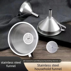 Three stainless steel wine strainer screens lay on the table and sponge.